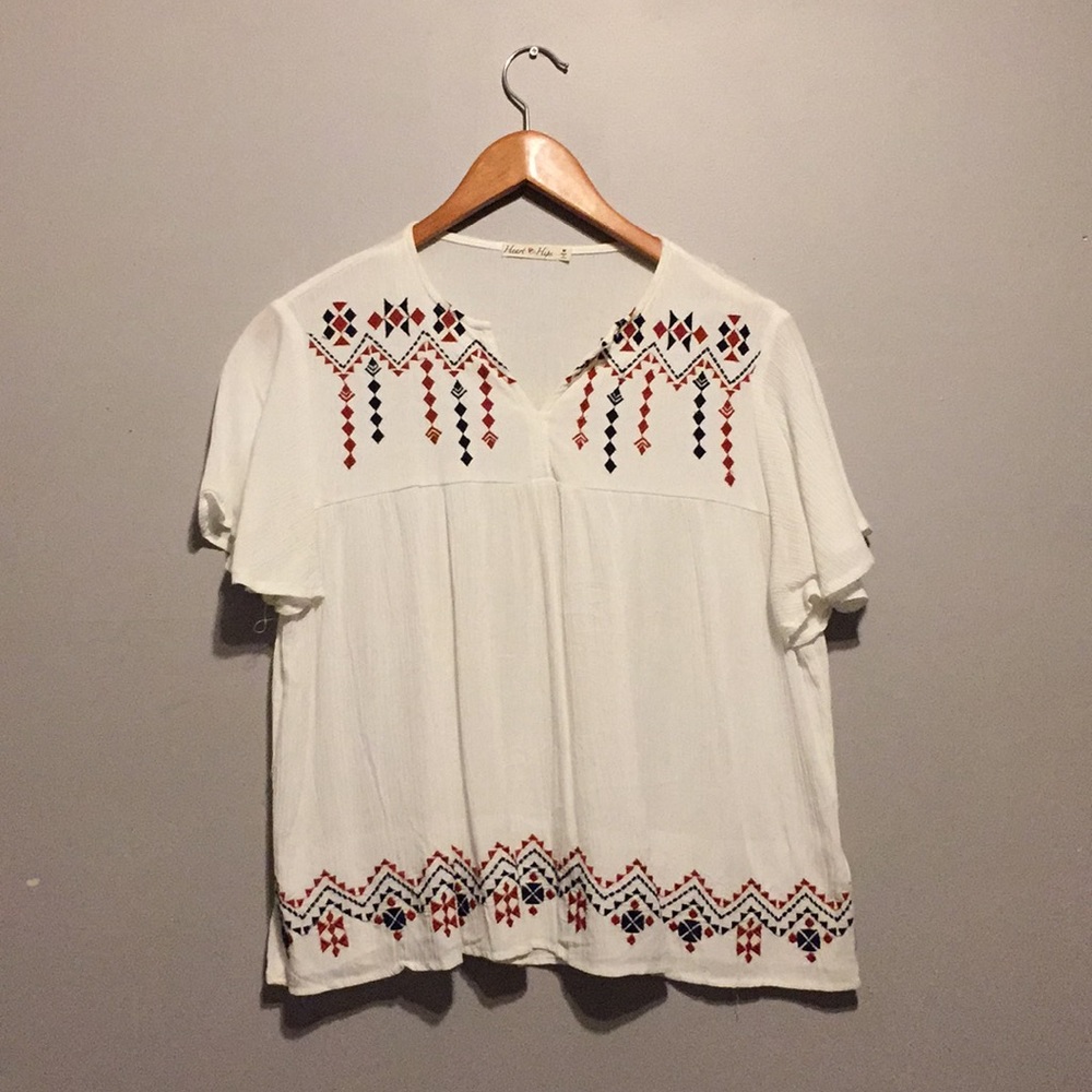White blouse with orange and blue pattern